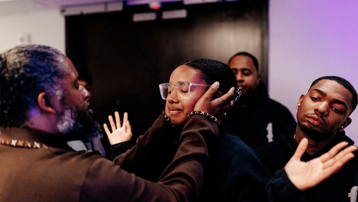 Intercessory prayer moment during ministry